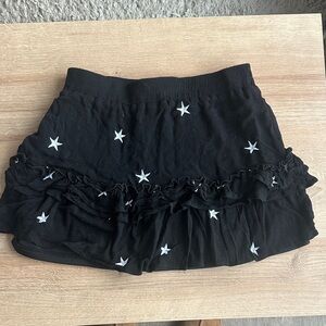 Black Ruffled Mini Skirt with Silver Star Details